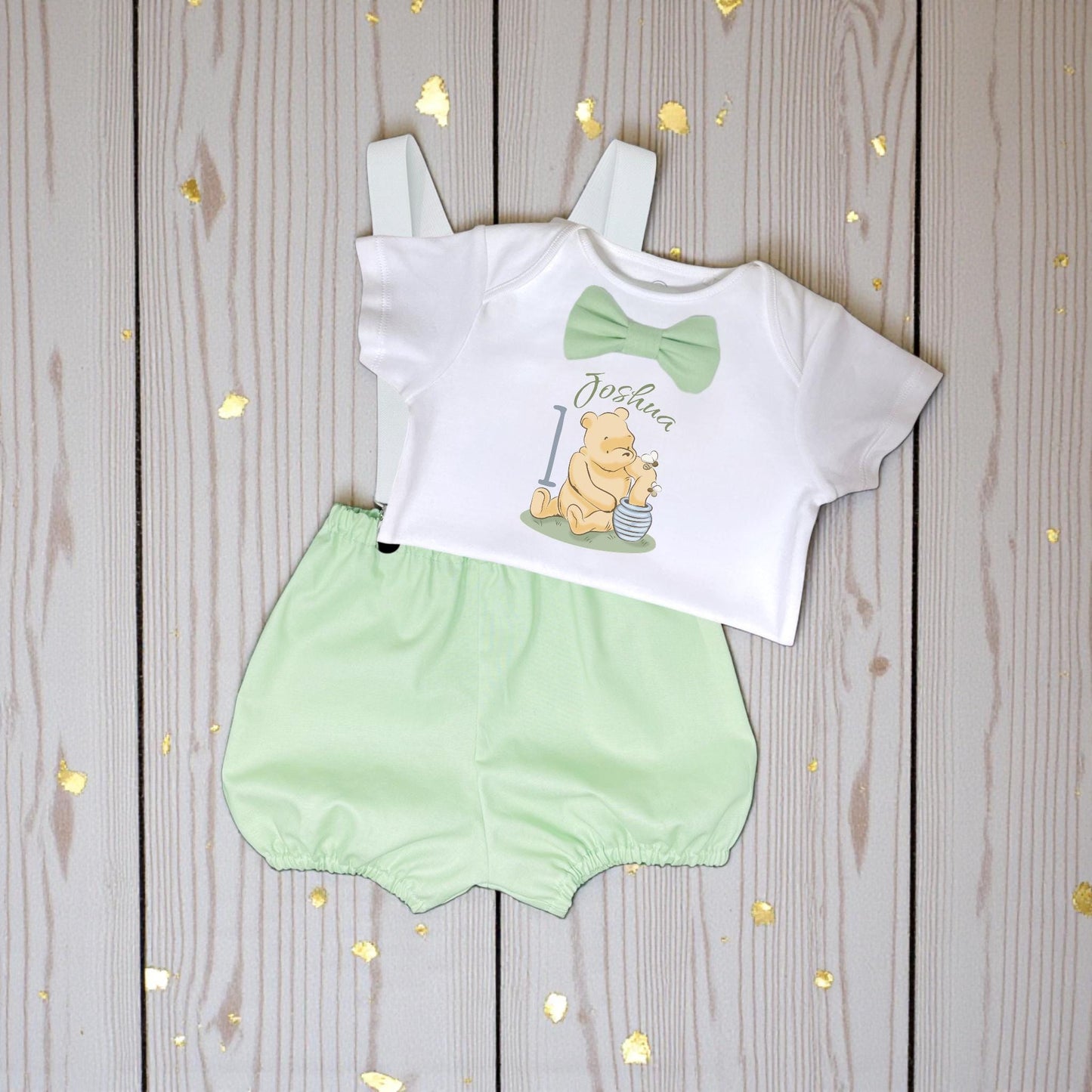 Green honey bear cake smash outfit flat lay