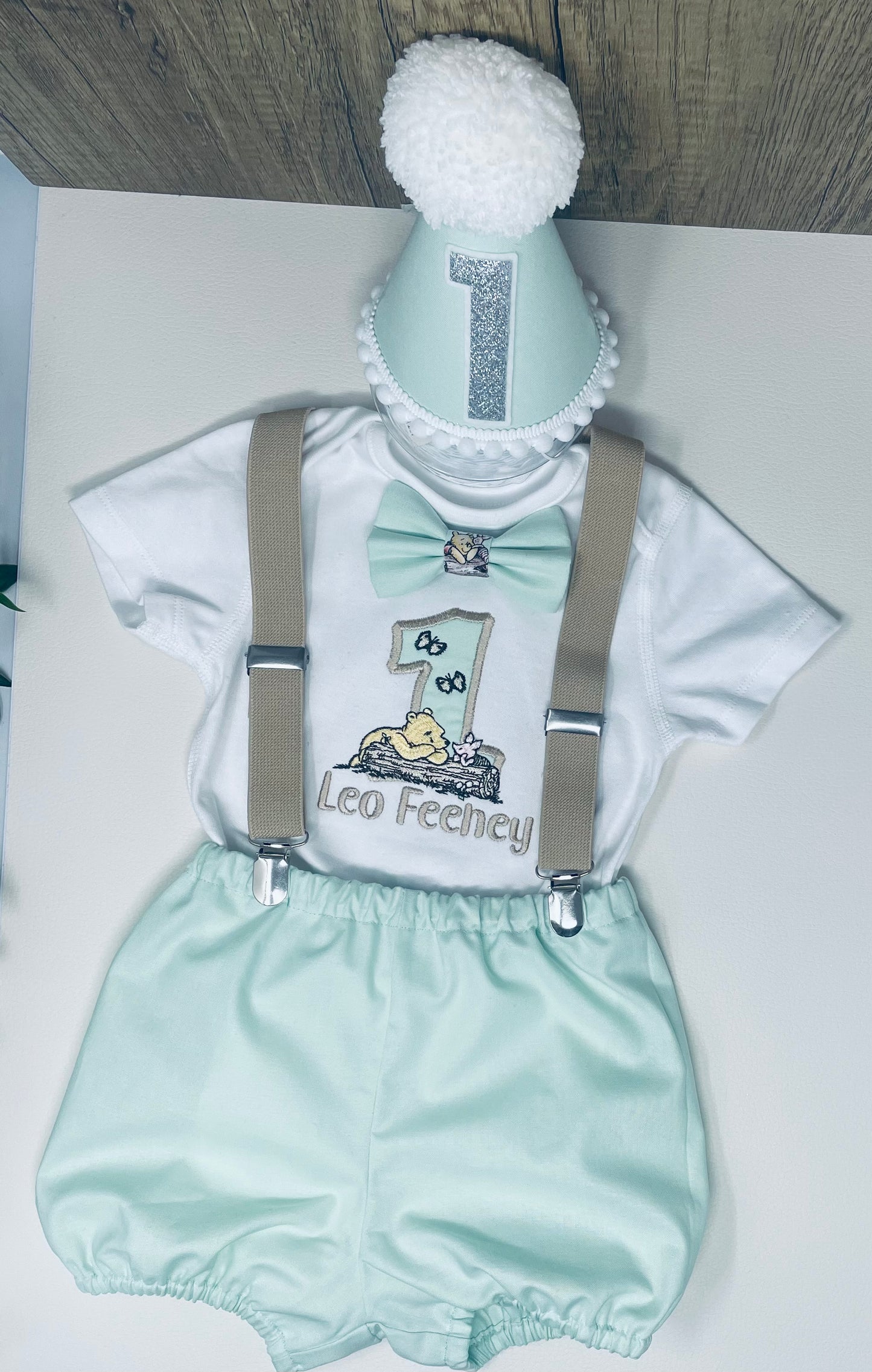 Classic Winnie the Pooh mint green baby boy’s cake-smash party outfit