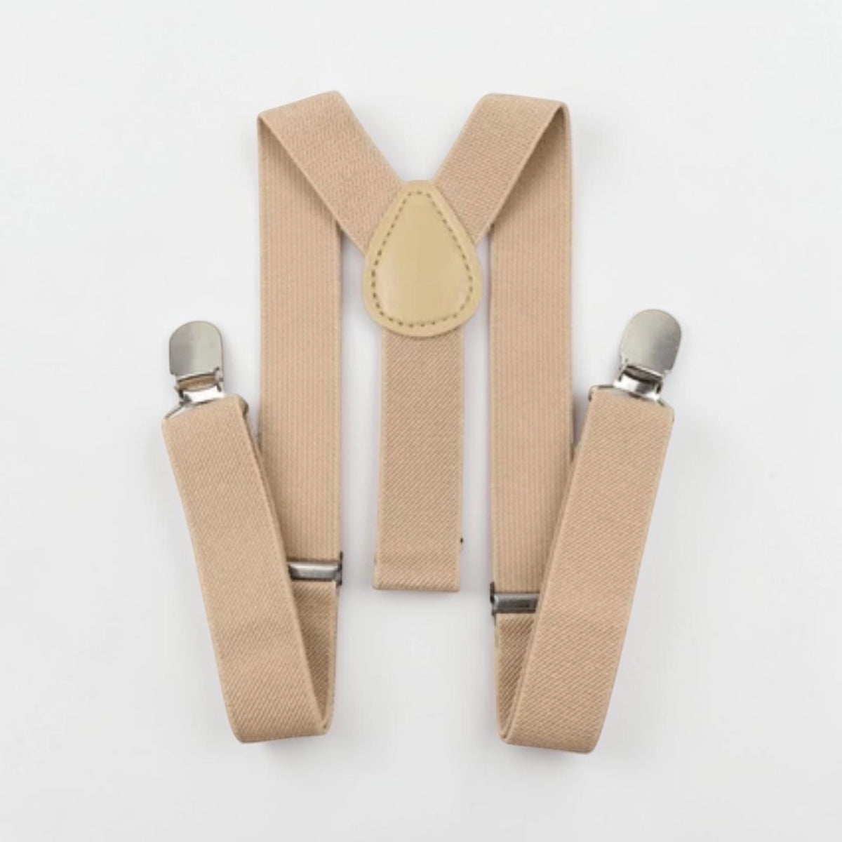 Adjustable beige suspender braces with silver metal clips and neutral-coloured centre detail, included with the handmade birthday outfit.