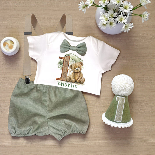 Personalised sage green bear first birthday outfit with printed bodysuit, sage bloomers, braces and matching party hat