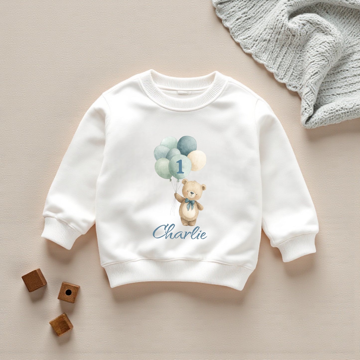 White printed sweatshirt featuring personalised balloon bear and balloons for a 1st birthday outfit