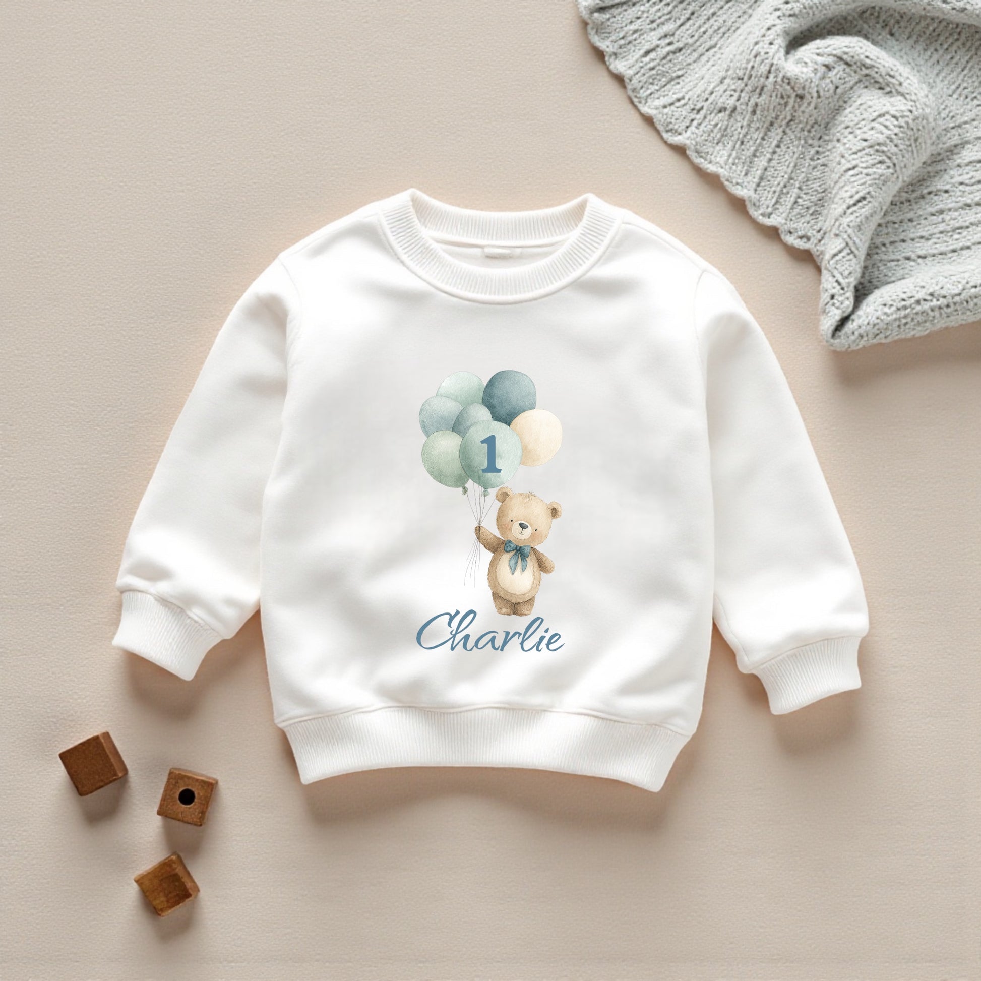 White printed sweatshirt featuring personalised balloon bear and balloons for a 1st birthday outfit