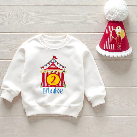 Personalised circus birthday sweatshirt with matching handmade red party hat and pom-pom, printed with child’s name and age