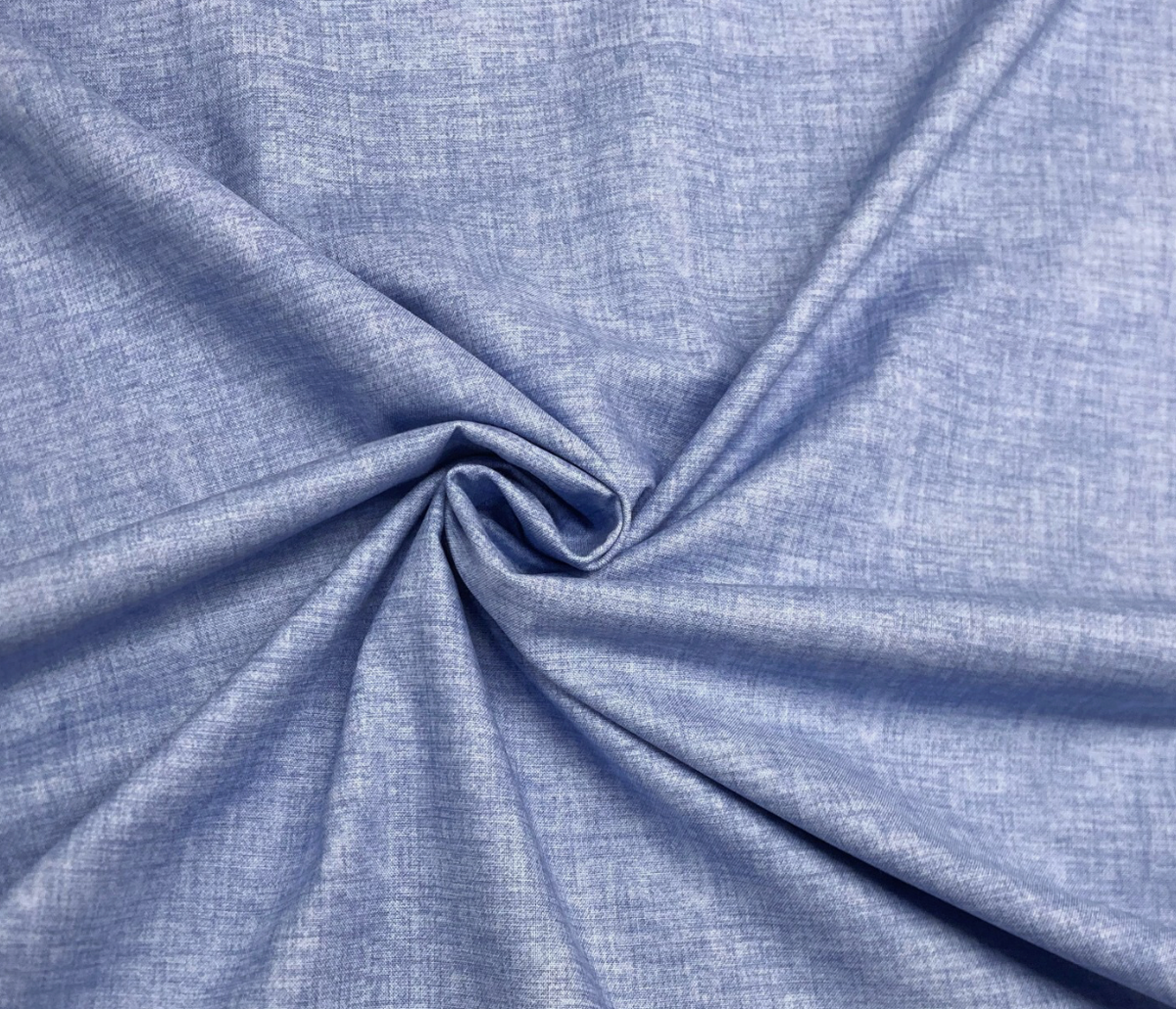 close up of John Loudens chambray blue fabric 